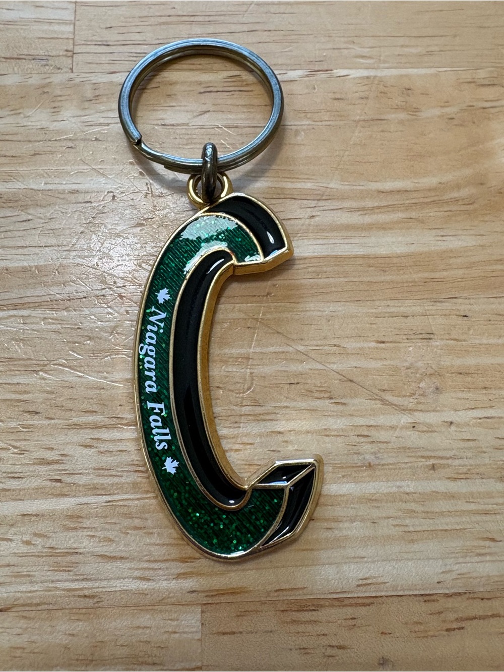 Niagara Falls Green & Black Letter C metal Keychain with green sparkles